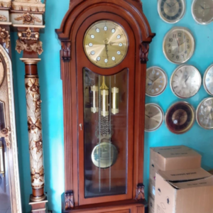 lemari jam ukiran jepara kayu jati